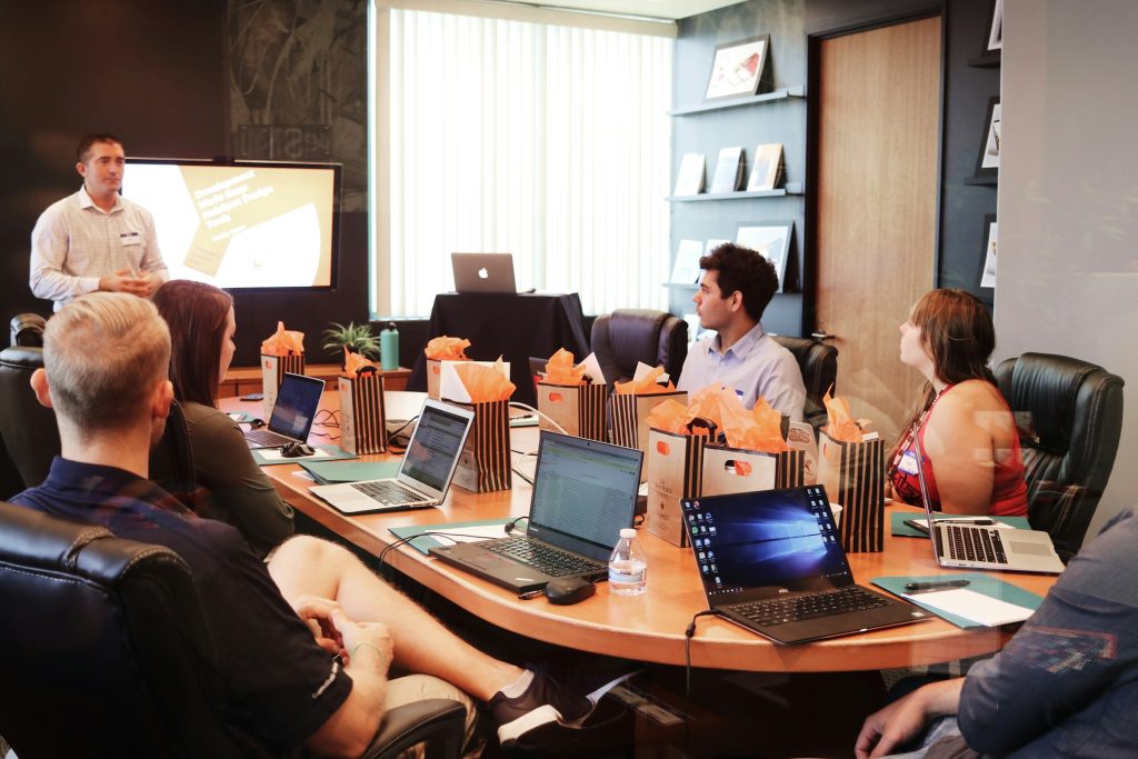campaign-creators-gMsnXqILjp4-unsplash employees in a meeting - seo bots